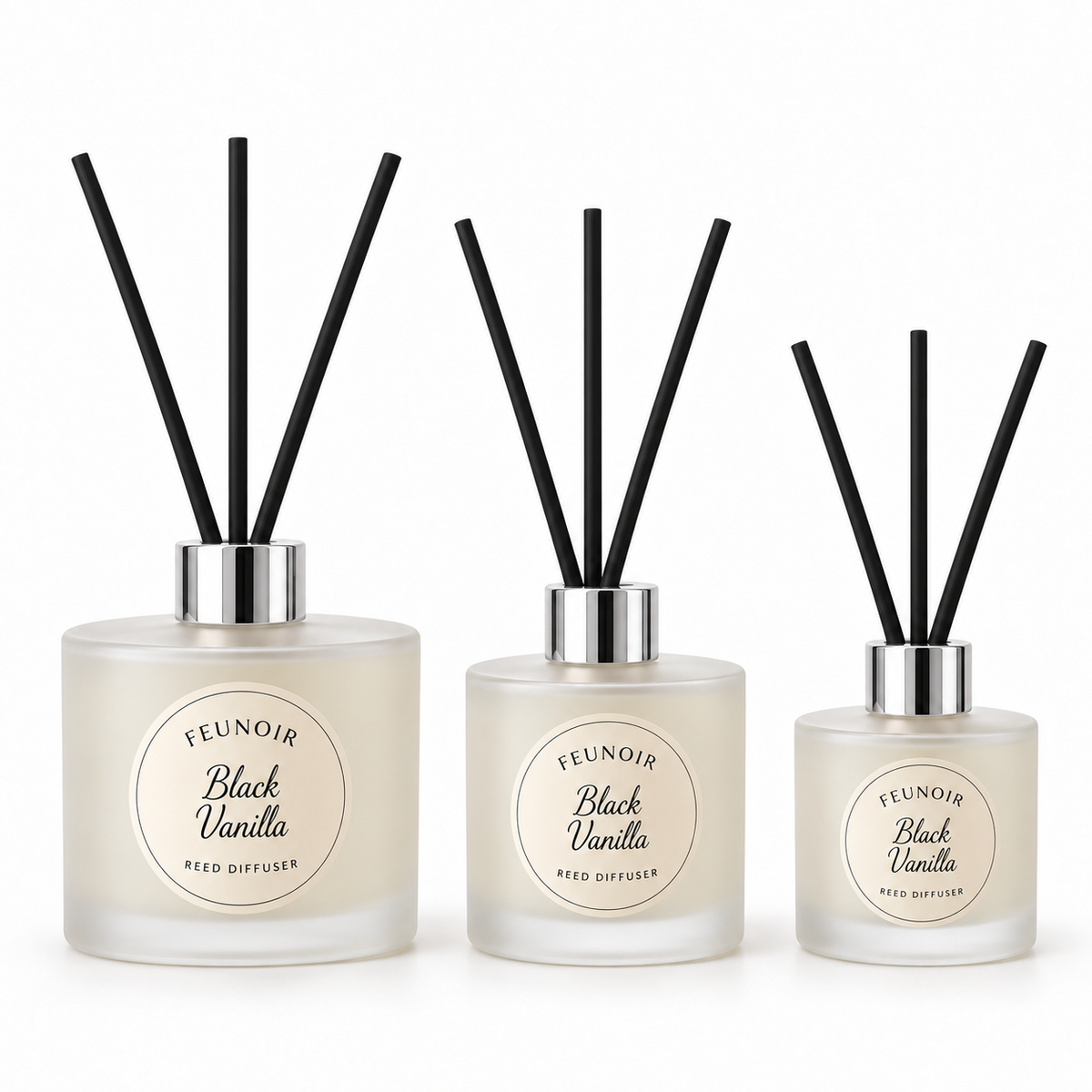 Feunoir Frosted reed diffuser containers with silver caps and exactly 3 black reeds each, largest first, white background