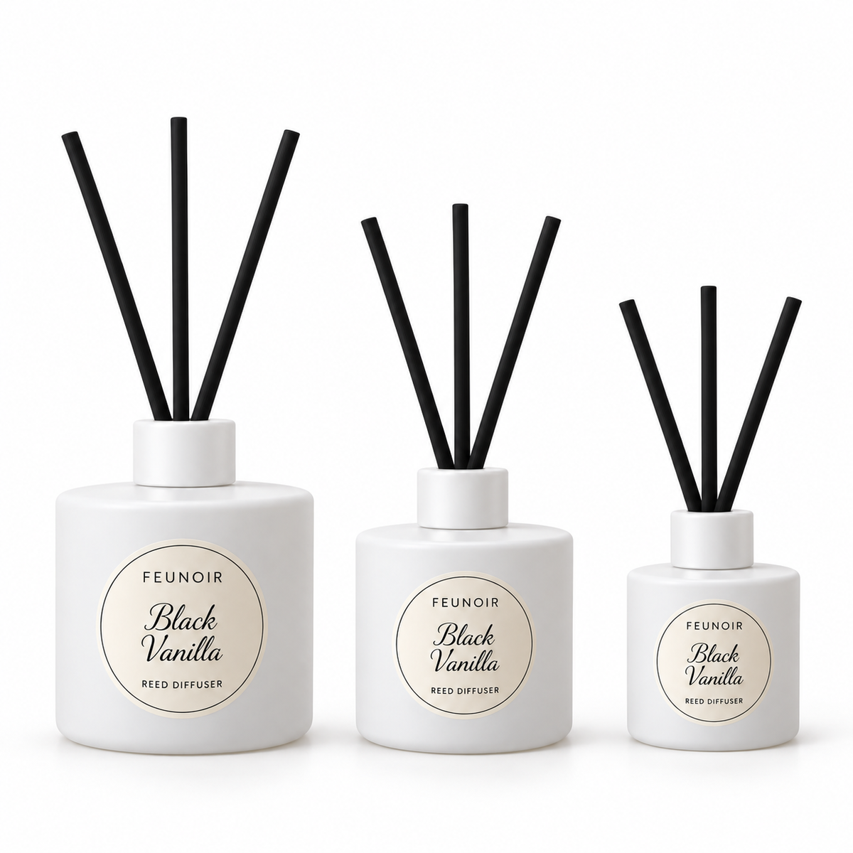 Feunoir White reed diffuser containers with white caps and exactly 3 black reeds each, largest first, white background