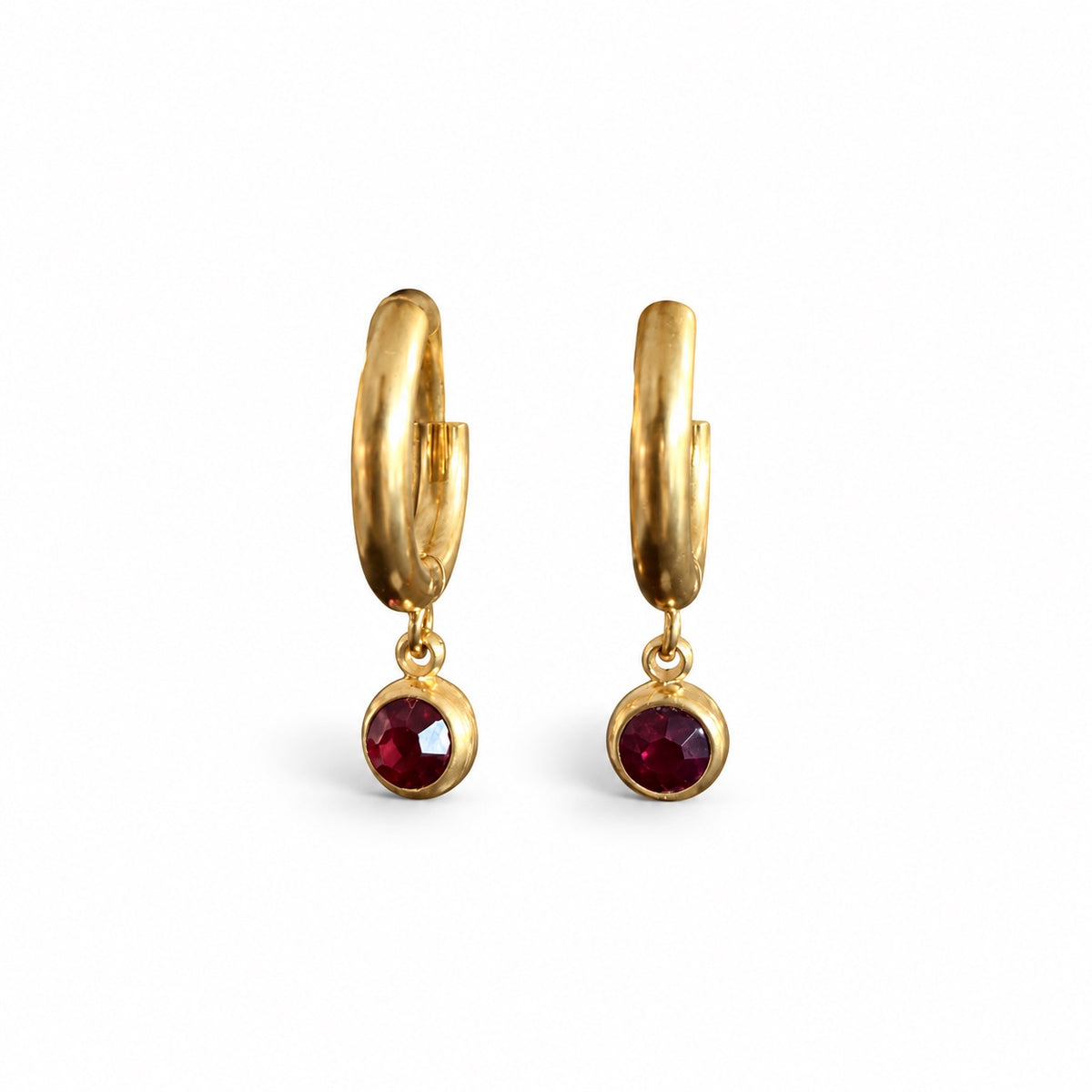 Ravena gold-tone huggie earrings with deep-red round stone drops by Juveele